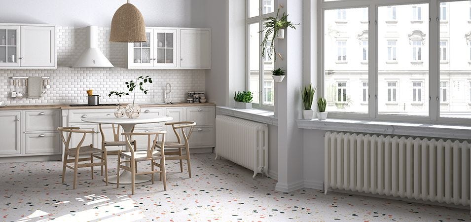 A kitchen with column radiators