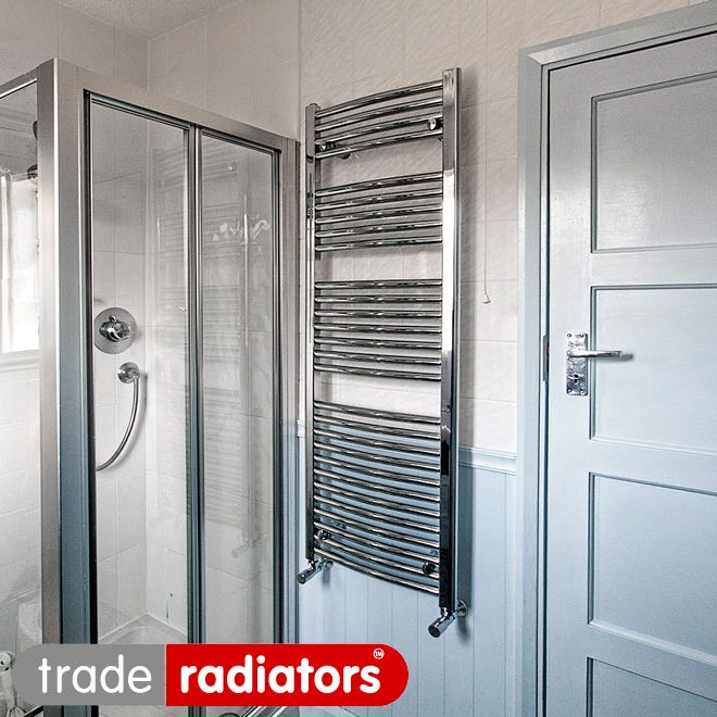 A chrome heated towel rail in a bathroom