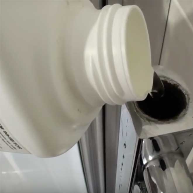 Chemical Inhibitor poured into a heated towel rail