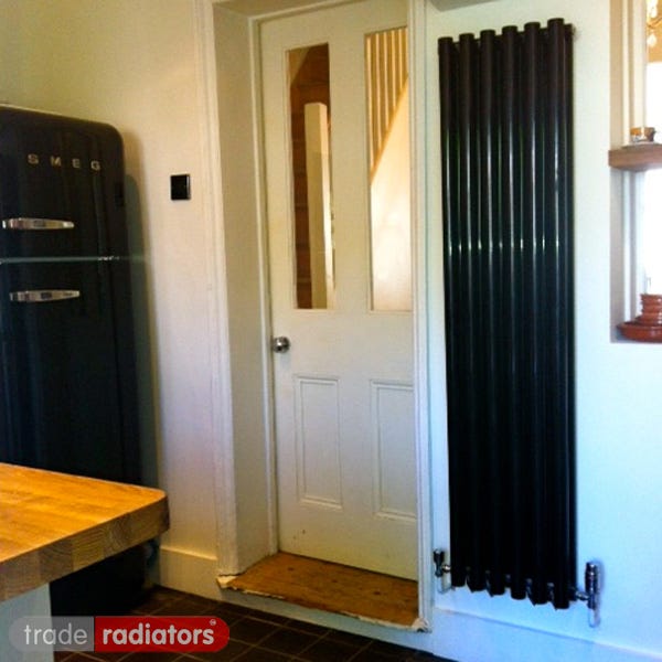Black Vertical Radiator installed in a kitchen