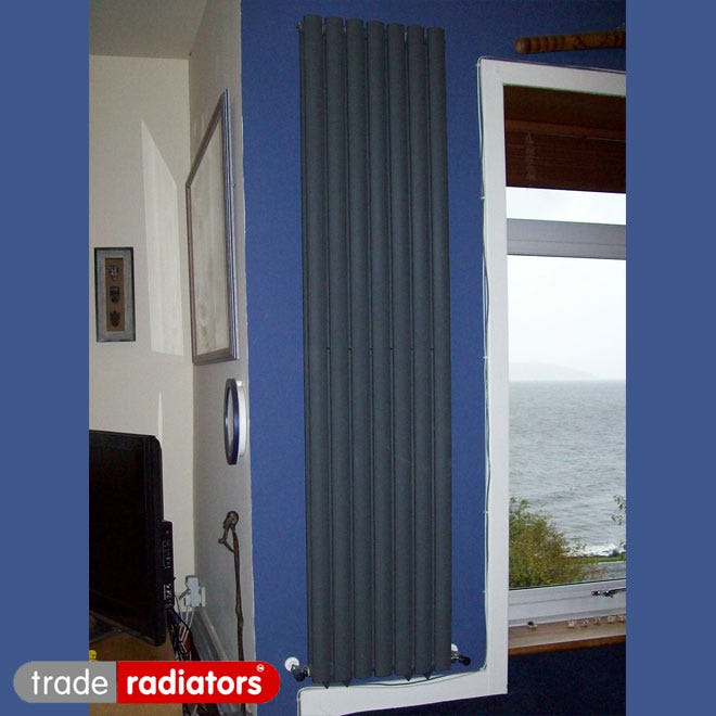 Anthracite vertical column radiator in a kitchen