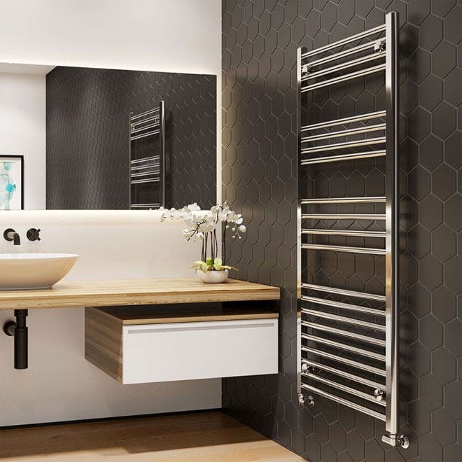 Trade Direct Towel Rail Chrome Straight 1200x500mm in a modern bathroom set against a stylish, black tiled wall.