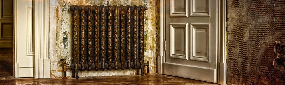 A vintage radiator in a Victorian-style room