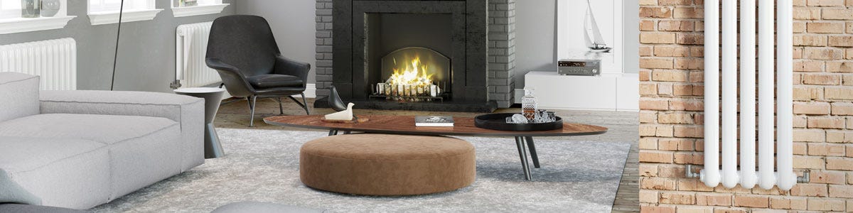 A vertical radiator in a room with an open fire