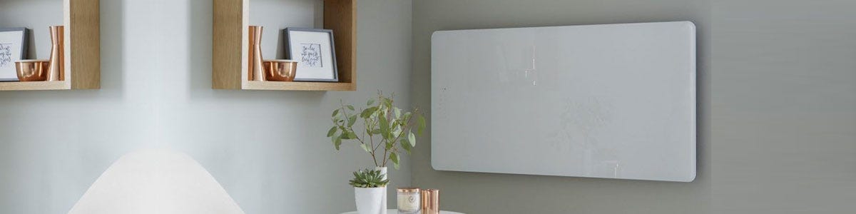 A glass electric panel radiator on a wall in a living room