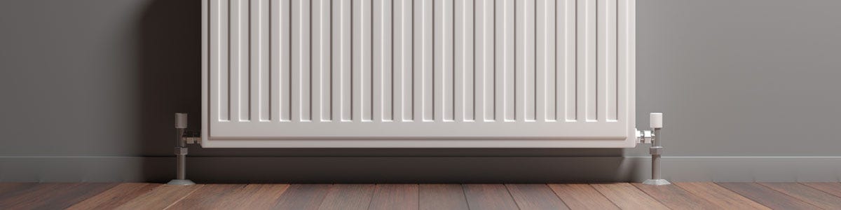 A white central heating convector radiator