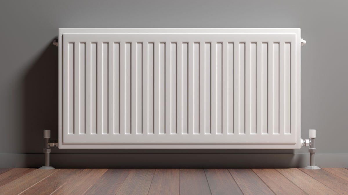 A white compact convector radiator