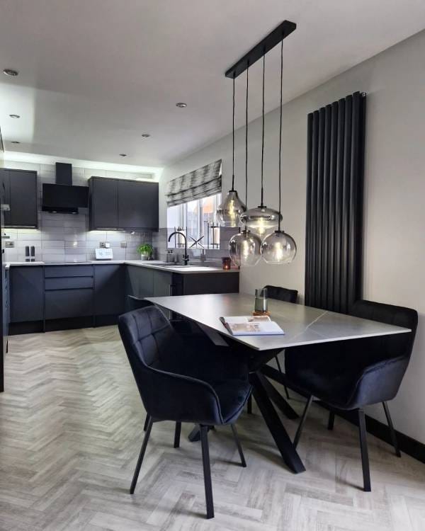 Black Saturn vertical radiator in a kitchen