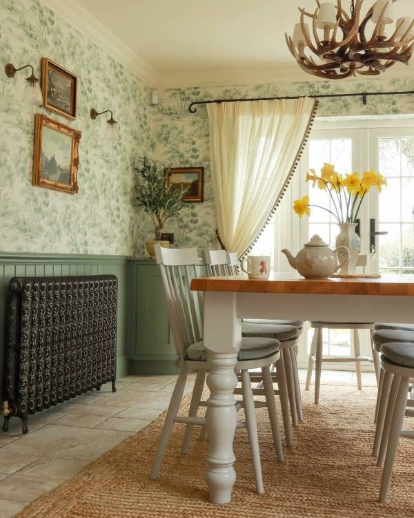 A traditional kitchen-diner featuring a Paladin Kensington cast iron radiator