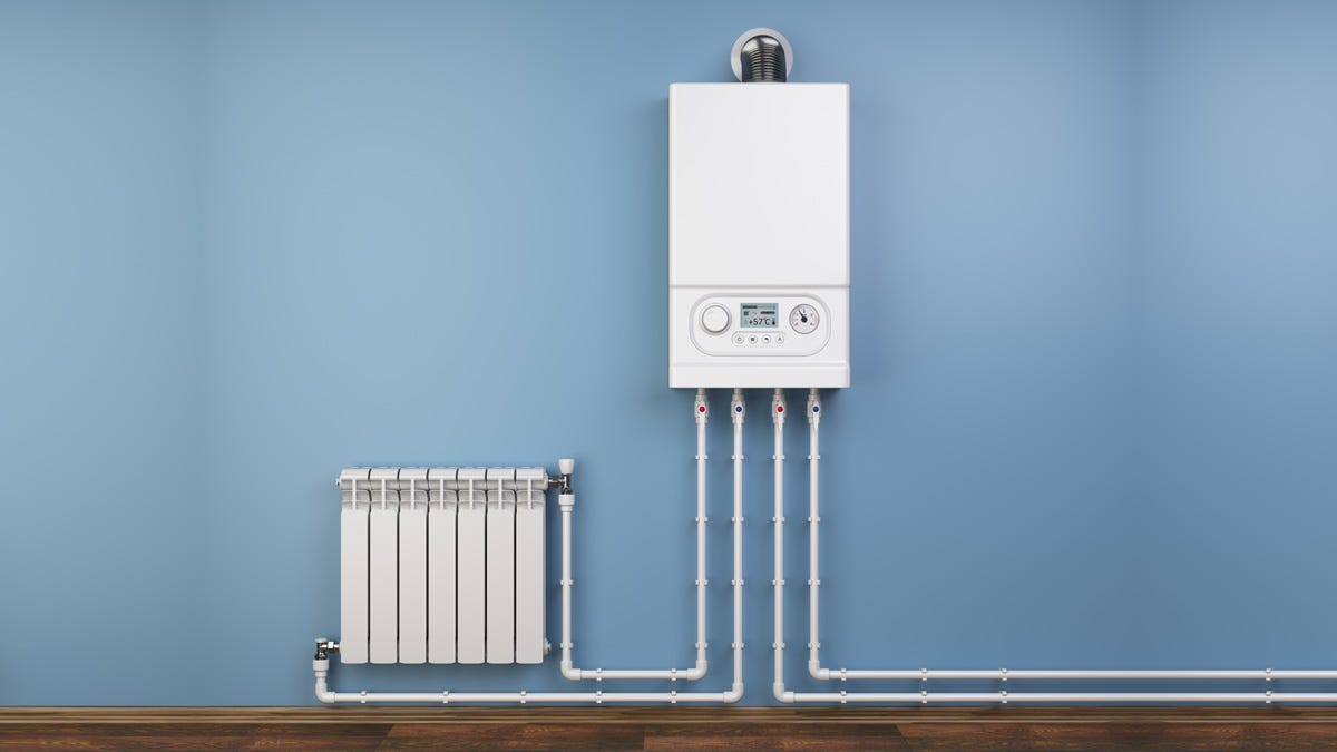 An image showing the flow and return pipes connected to a radiator and a central heating boiler