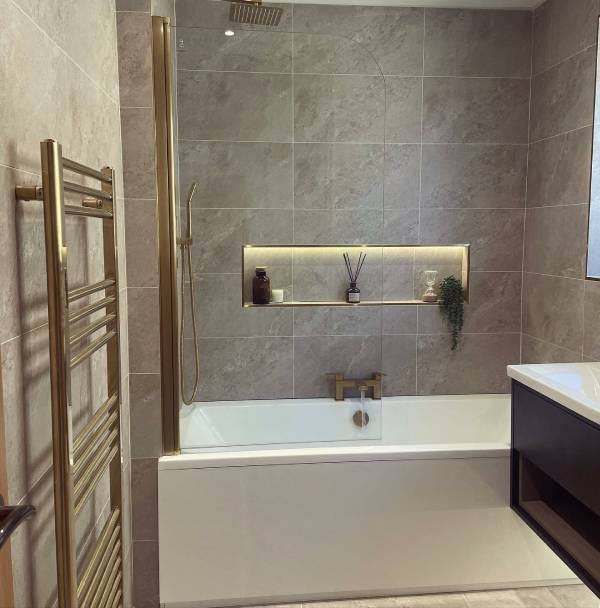 A brushed brass Reina Ottone towel radiator