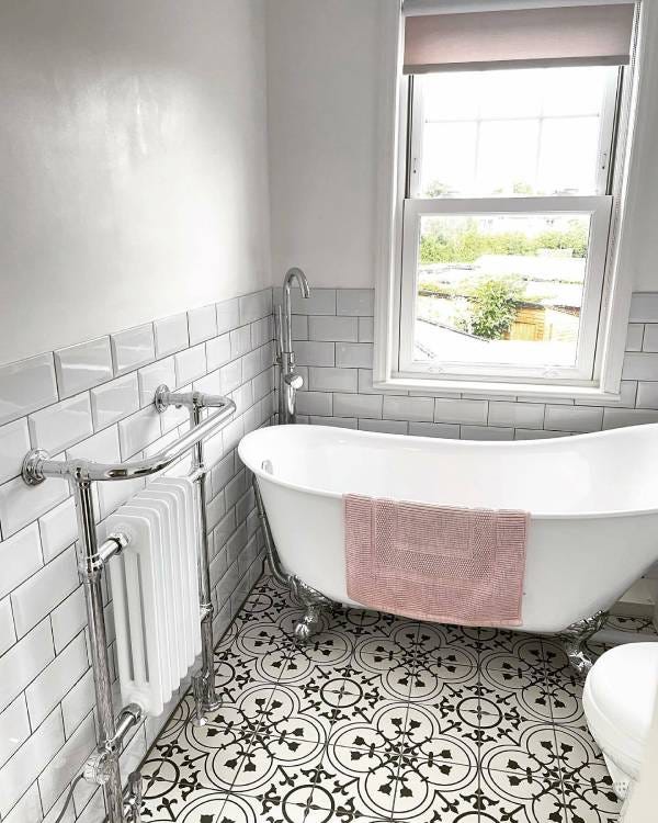 A Trade Direct Classic towel radiator with 3 columns and finished in white and chrome
