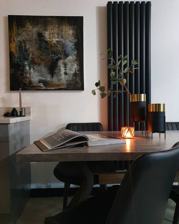 An Elite Icon vertical column radiator finished in black